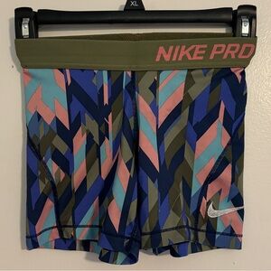 Green, Pink, Purple, and Blue Nike Pros